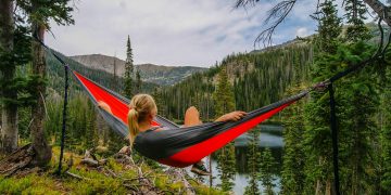 woman on hammock near to river